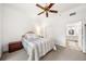 This bedroom features carpeted floors, a ceiling fan, and an ensuite bathroom with tiled floors at 1101 Juniper Ne St # 1519, Atlanta, GA 30309