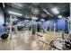 Modern fitness center featuring strength training equipment, weights, and mirrored walls at 1101 Juniper Ne St # 1519, Atlanta, GA 30309