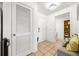 Welcoming hallway with tan tile flooring and entry to bathroom and closet at 1101 Juniper Ne St # 1519, Atlanta, GA 30309
