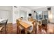 This living room and dining area features hardwood floors, updated lighting, and cityscape views at 1101 Juniper Ne St # 1519, Atlanta, GA 30309