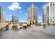Enjoy city views from this rooftop deck, complete with lounge seating and potted plants at 1101 Juniper Ne St # 1519, Atlanta, GA 30309