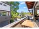 Enjoy the view from the balcony with a wooden table and chairs, accessible via sliding glass doors at 1331 Iverson Ne St # A, Atlanta, GA 30307