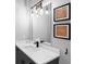 Stylish bathroom features modern vanity, vessel sink, designer lighting, and framed art at 1331 Iverson Ne St # A, Atlanta, GA 30307