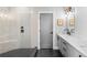 Modern bathroom featuring a glass shower, marble countertop vanity, and contemporary finishes at 1331 Iverson Ne St # A, Atlanta, GA 30307