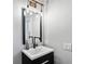 Stylish bathroom features a modern vanity with unique lighting and fixtures at 1331 Iverson Ne St # A, Atlanta, GA 30307