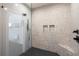 Modern bathroom with a glass-enclosed shower, unique tile work, and contemporary fixtures at 1331 Iverson Ne St # A, Atlanta, GA 30307