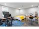 Dual-purpose bedroom/gym features natural light, a desk, TV, and workout equipment at 1331 Iverson Ne St # A, Atlanta, GA 30307