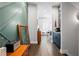 Welcoming entry with modern green wall, wooden accents, and stylish decor, leading to the dining room at 1331 Iverson Ne St # A, Atlanta, GA 30307