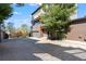 Modern home with a large driveway, wood accents, and mature tree at 1331 Iverson Ne St # A, Atlanta, GA 30307