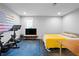Flex room features gym area, television, a bed, and natural light at 1331 Iverson Ne St # A, Atlanta, GA 30307
