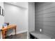 Modern hallway features a desk, storage bench, and unique wood plank wall at 1331 Iverson Ne St # A, Atlanta, GA 30307