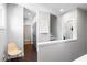 Bright hallway features hardwood floors, fresh paint, modern art, and access to multiple rooms at 1331 Iverson Ne St # A, Atlanta, GA 30307