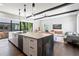 Open concept kitchen and living area with large island, sleek appliances, and hardwood floors at 1331 Iverson Ne St # A, Atlanta, GA 30307