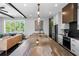 Bright kitchen with large island, stainless steel appliances and view of adjacent living space at 1331 Iverson Ne St # A, Atlanta, GA 30307