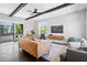 Bright living room featuring hardwood floors, modern furnishings, and access to a balcony with a view at 1331 Iverson Ne St # A, Atlanta, GA 30307