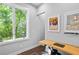 Bright office space with a large window, natural light, wooden desk, and minimalist decor for productivity at 1331 Iverson Ne St # A, Atlanta, GA 30307