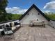 Inviting rooftop deck featuring comfortable seating, a dining table, and pleasant treetop views at 1331 Iverson Ne St # A, Atlanta, GA 30307