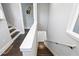 Bright staircase with wooden steps and white handrails provides access to upper levels at 1331 Iverson Ne St # A, Atlanta, GA 30307