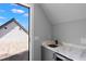 Chic wet bar complements rooftop deck access with a marble countertop and sink at 1331 Iverson Ne St # A, Atlanta, GA 30307
