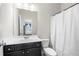 Bright bathroom features a white shower curtain, modern vanity, and an updated toilet at 144 Still Pine Bnd, Smyrna, GA 30082