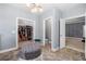 Dressing area features decorative lighting, tile floors, walk-in closet, and separate water closet at 144 Still Pine Bnd, Smyrna, GA 30082