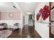 Elegant entryway showcases dark hardwood floors and a view to the staircase with a sitting area to the left at 144 Still Pine Bnd, Smyrna, GA 30082
