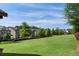 Scenic view of neighborhood homes backing up to well-maintained green space at 144 Still Pine Bnd, Smyrna, GA 30082