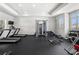 Bright gym with modern equipment, rubber flooring, and large windows at 144 Still Pine Bnd, Smyrna, GA 30082