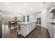 Open-concept kitchen with granite countertops, stainless appliances, a kitchen island, and view to the dining room at 144 Still Pine Bnd, Smyrna, GA 30082