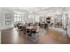 Inviting living space with fireplace, hardwood floors, and ample natural light at 144 Still Pine Bnd, Smyrna, GA 30082