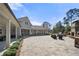 Spacious patio featuring an outdoor kitchen, fireplace, and ample seating at 144 Still Pine Bnd, Smyrna, GA 30082