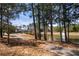 Scenic pond offers a walking trail, fountain, and lush trees for a peaceful setting at 144 Still Pine Bnd, Smyrna, GA 30082