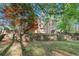 Landscaped backyard with retaining wall and view of the rear of the home at 160 Winter Park Ln, Powder Springs, GA 30127