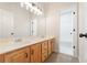 Bathroom with double vanity, wood cabinets and a bright white color palette at 160 Winter Park Ln, Powder Springs, GA 30127