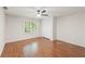 Bedroom featuring beautiful wood floors, closet, and a ceiling fan at 160 Winter Park Ln, Powder Springs, GA 30127