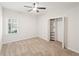 Bright bedroom featuring plush carpeting, a ceiling fan and a closet at 160 Winter Park Ln, Powder Springs, GA 30127