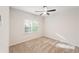 Bedroom with a large window providing natural light and comfortable carpeting at 160 Winter Park Ln, Powder Springs, GA 30127