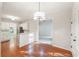 Dining space offering hardwood floors and views into kitchen and living areas at 160 Winter Park Ln, Powder Springs, GA 30127