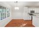 Dining area with hardwood floors, bright windows and contemporary chandelier at 160 Winter Park Ln, Powder Springs, GA 30127
