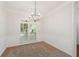 Cozy dining room featuring wainscoting, and decorative lighting fixture at 160 Winter Park Ln, Powder Springs, GA 30127
