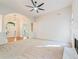 Open concept living room with arched entryway, fireplace and abundant natural light at 160 Winter Park Ln, Powder Springs, GA 30127
