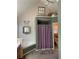 Bathroom featuring a tub, shower with patterned curtain, and vaulted ceilings at 33 Ashland Cir, Douglasville, GA 30134