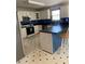 Well-lit kitchen featuring white cabinets, black countertops, and modern stainless steel appliances at 33 Ashland Cir, Douglasville, GA 30134