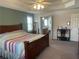 Spacious main bedroom with a large bed and a view into the connected bathroom at 33 Ashland Cir, Douglasville, GA 30134