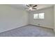 An airy bedroom with a ceiling fan and a large window allowing for ample natural light at 5350 Rockbridge Rd, Stone Mountain, GA 30088