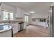 Modern kitchen with white cabinets, stainless steel appliances, and wood-look flooring at 5350 Rockbridge Rd, Stone Mountain, GA 30088