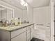 Clean bathroom showcasing double sinks with granite countertops and a built-in soaking tub at 6322 Scudders Dr, Lithonia, GA 30058