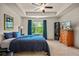 Comfortable bedroom with tray ceilings, natural light, and a cozy ambiance at 6322 Scudders Dr, Lithonia, GA 30058