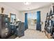Well-lit office space with a large window and ample storage at 6322 Scudders Dr, Lithonia, GA 30058