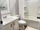 Clean bathroom with a combination shower-tub, modern fixtures, and white cabinets at 251 Turner Ln, Woodstock, GA 30188